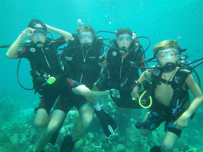 Family scuba diving in the Bay Islands, Honduras