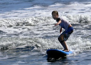 nathan learning to surf tahiti