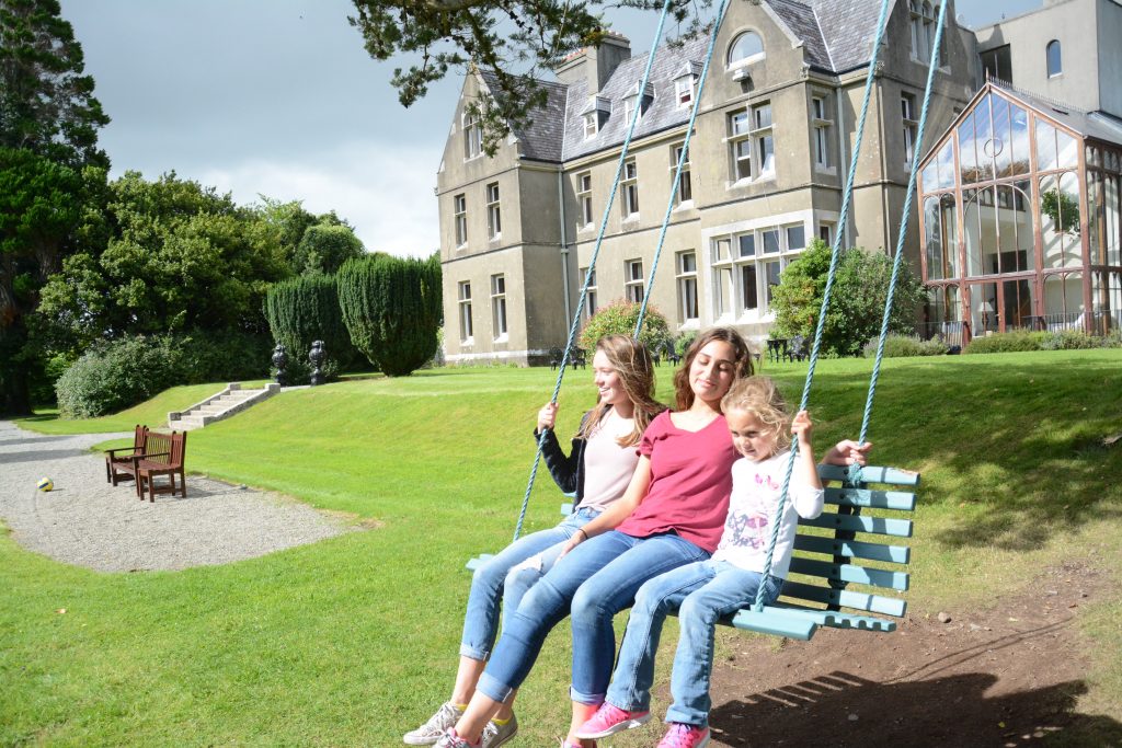 Annie, Caroline and Lela enjoy swinging at a country manor near Killarney, Ireland