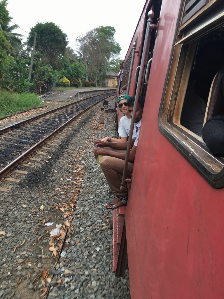 Nathan riding train from Colombo to Galle in Sri Lanka