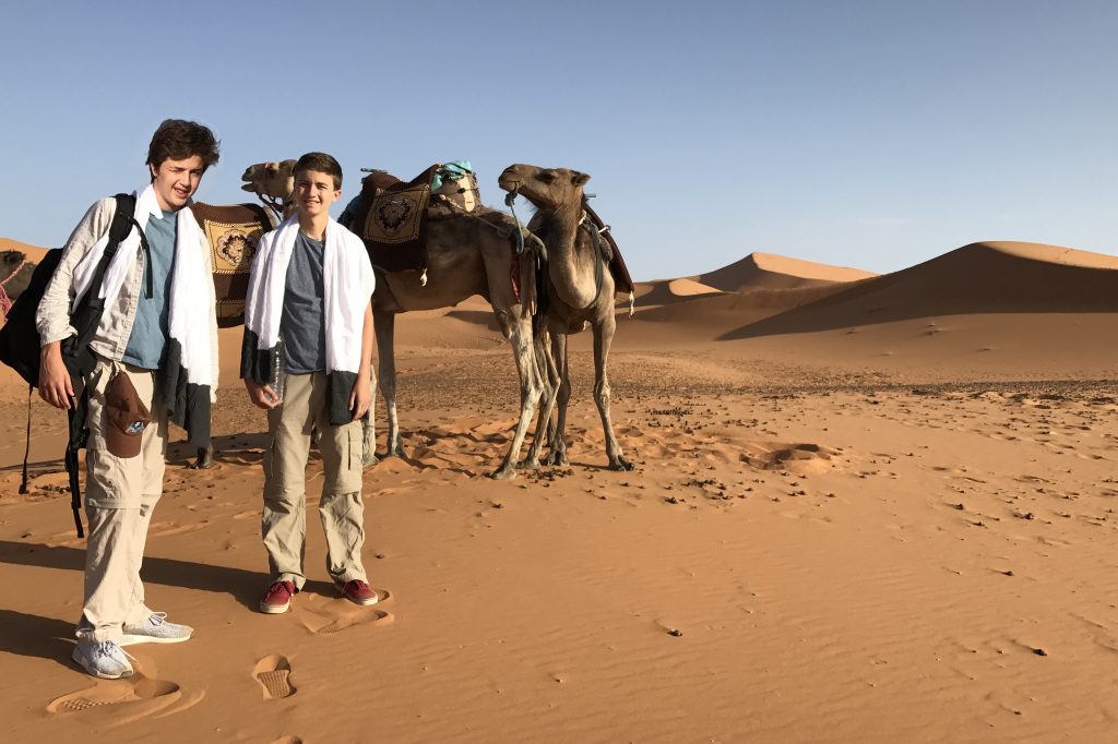 Nathan and Seamus on camel trek on our family vacation in Morocco