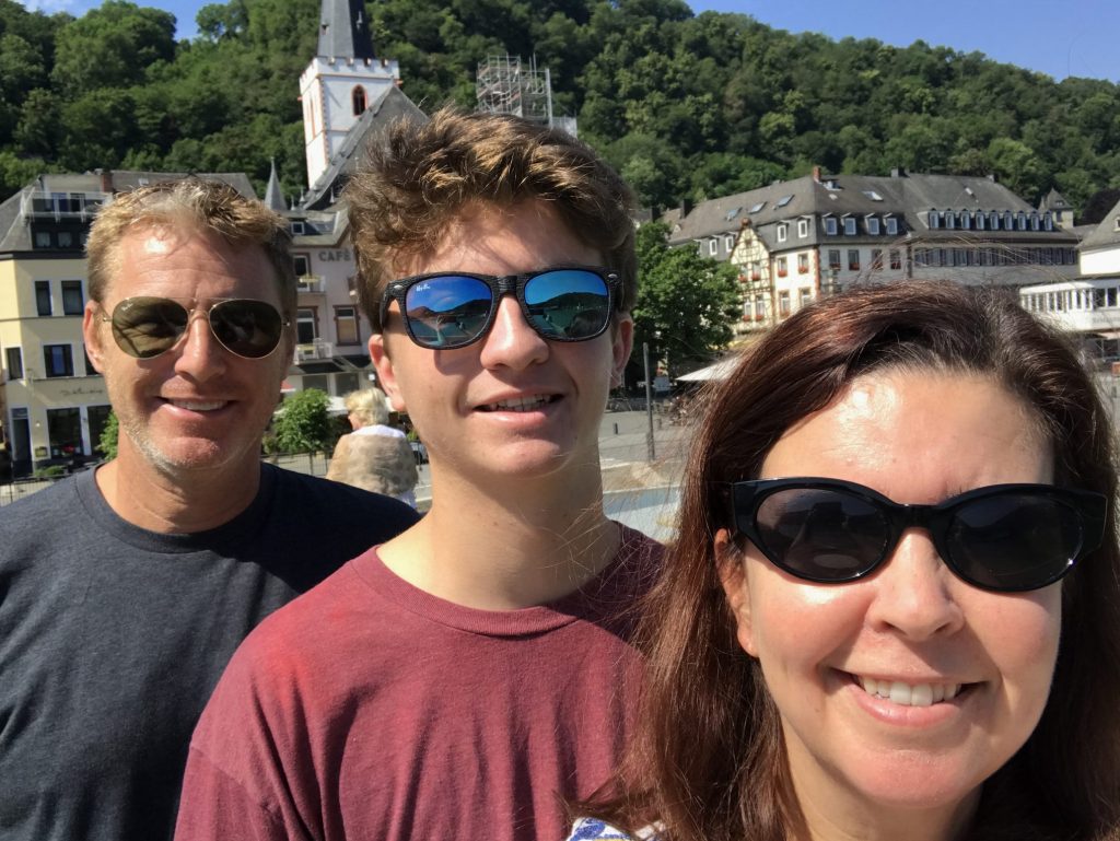 Family in front of St. Goar on the Rhine River in Germany
