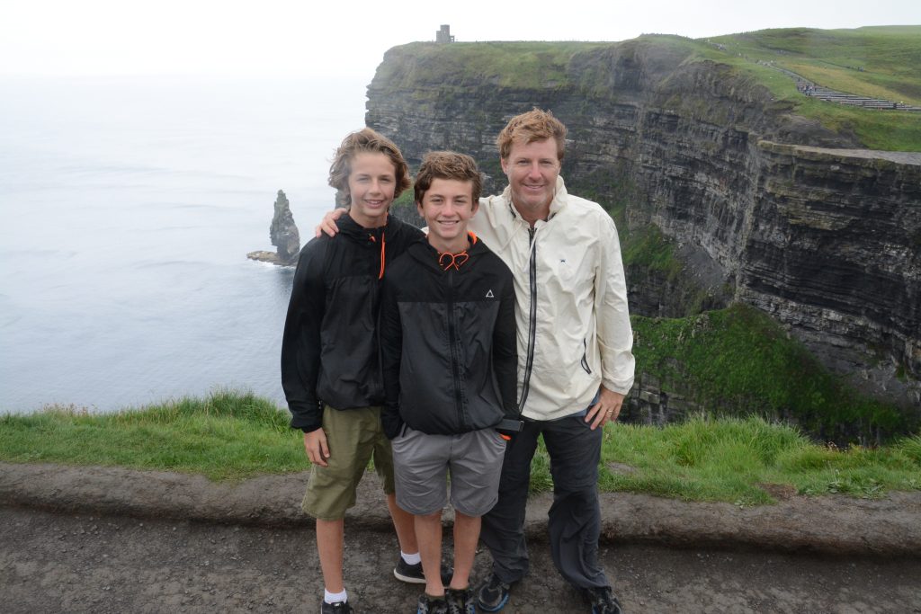 Family in front of Cliffs of Moher in Ireland