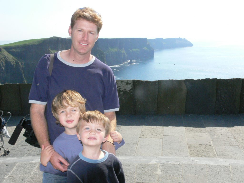 Family in front of Cliffs of Moher in Ireland