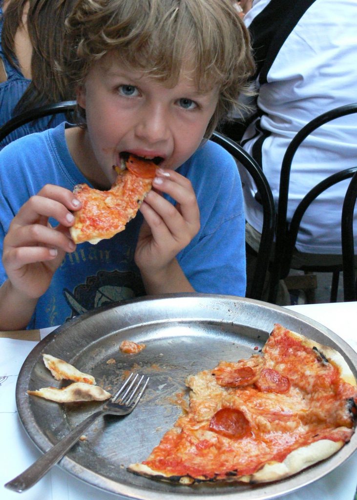 Child eating pizza