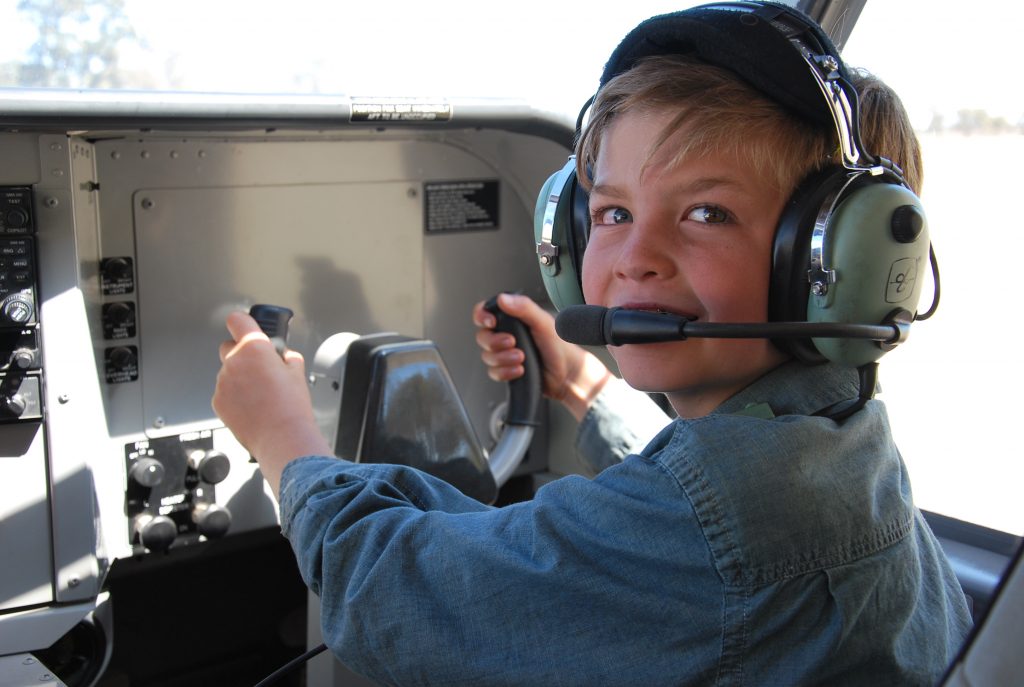 boy flying plane