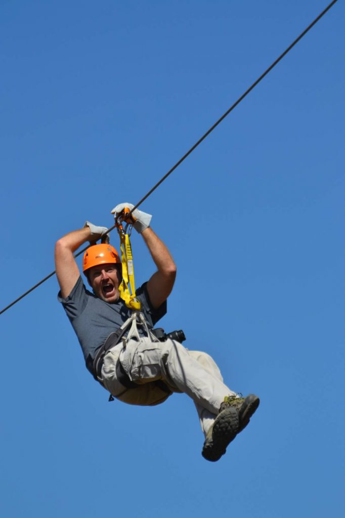 Man screaming as he travels across zip line in Peru