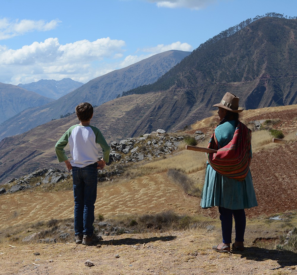 Boy and woman at scenic overlook in Sacred Valley, Peru