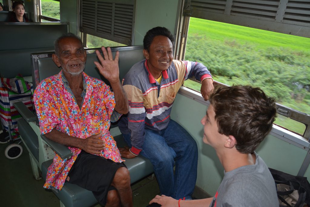 Boy and two men on train