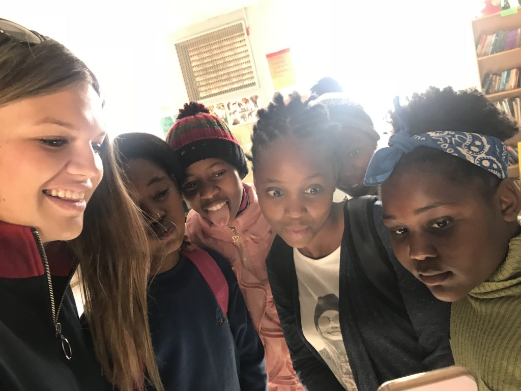 Teenage girls smile while taking picture in South Africa