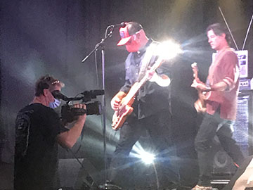 Camerman films band on stage